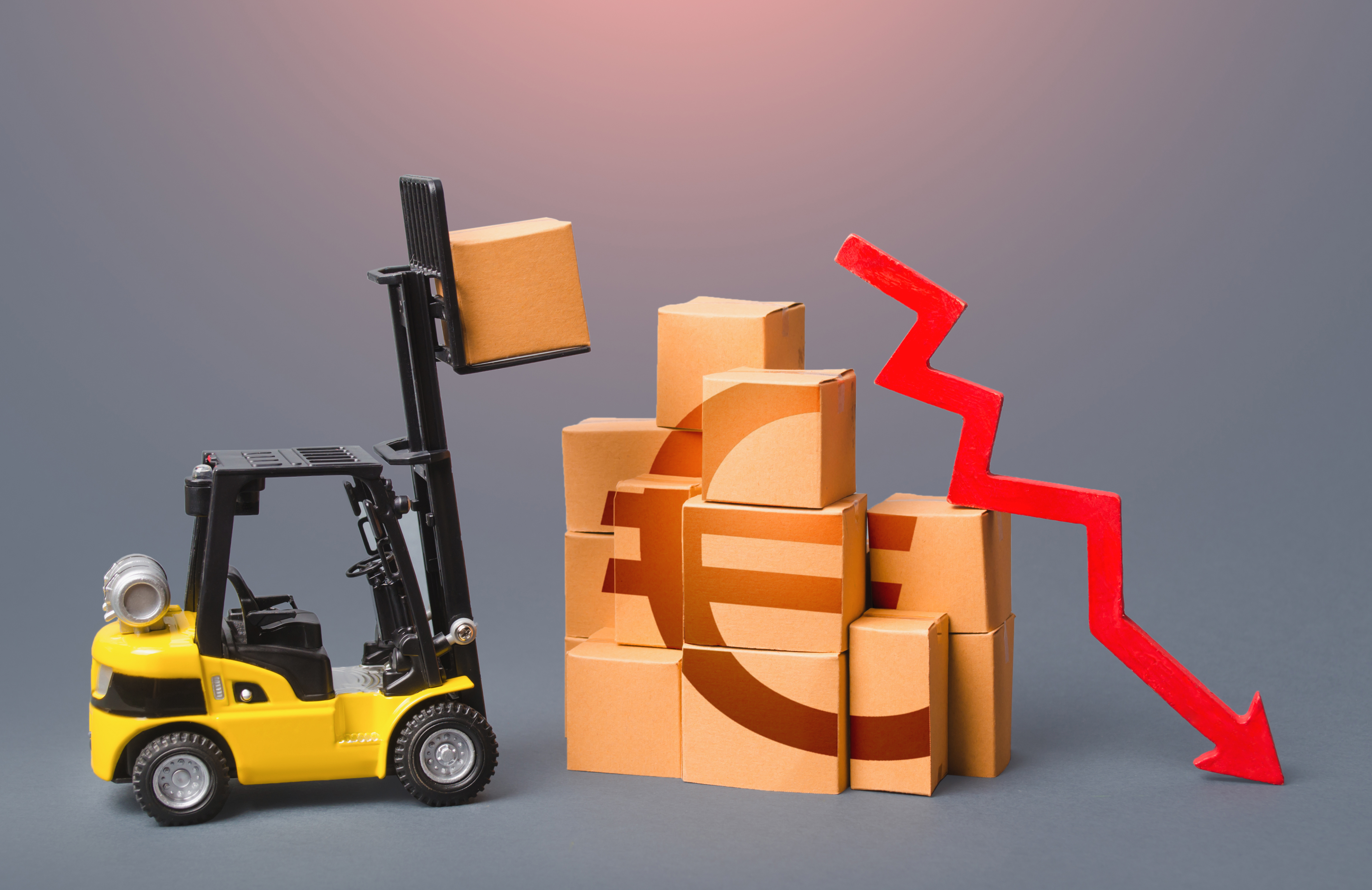 Goods boxes with Euro symbol and red down arrow. revenue drop in the trade and transport industry.